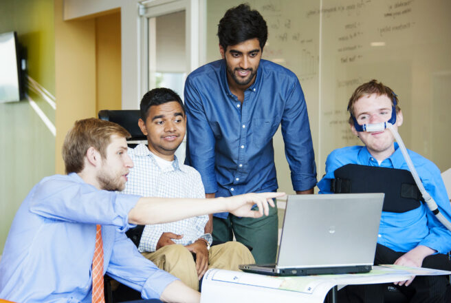 group of students looking at screen