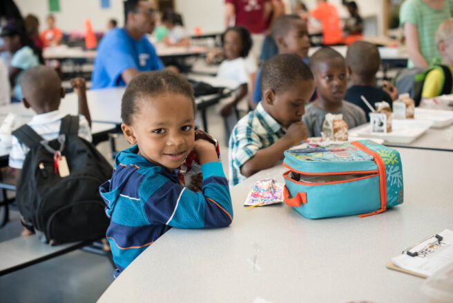 image of child eating lunch at school 