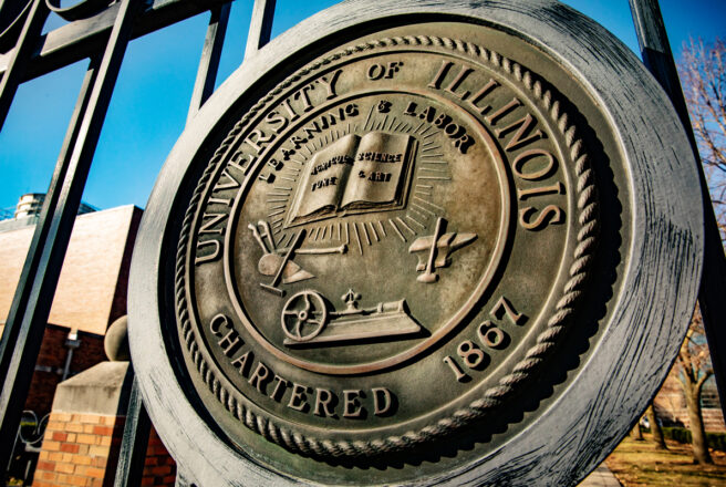 image of gate with University of Illinois seal