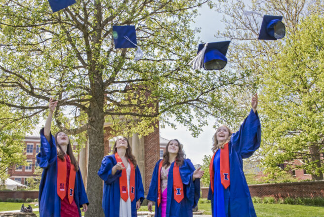 grads throwing caps in air