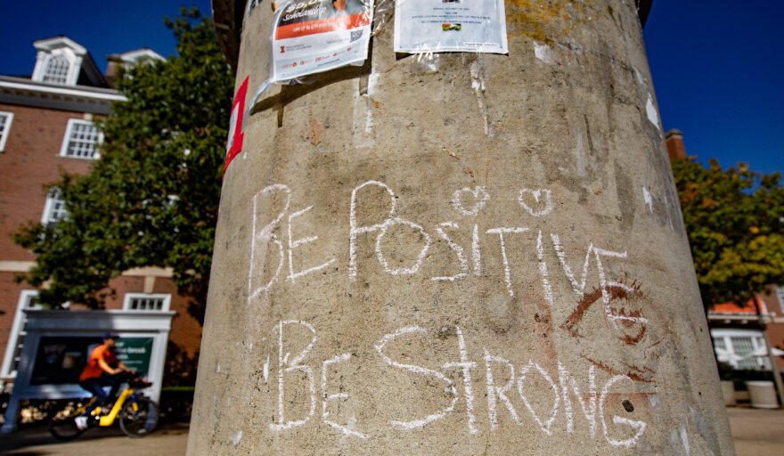 image of message written on pole on Quad