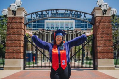 Student standing in front of Grange Grove