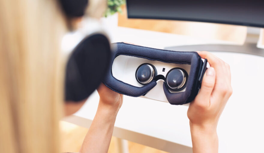 Young woman using virtual reality headset