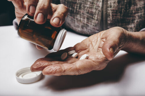 Senior woman taking medicine