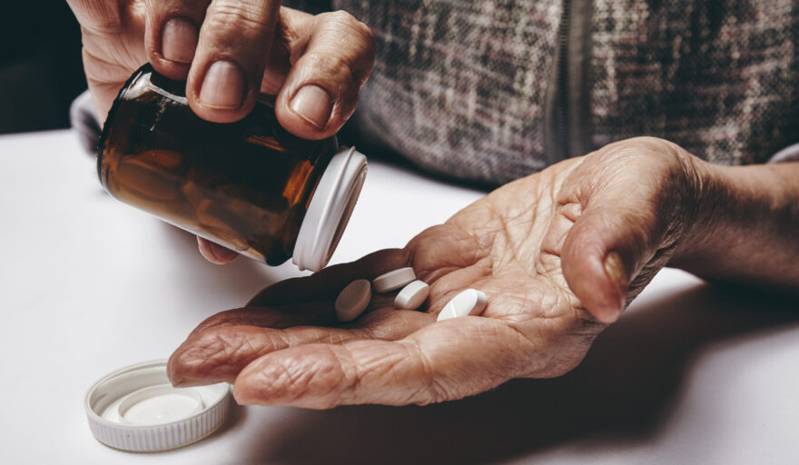 Senior woman taking medicine