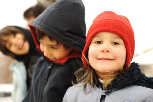 image of happy children in winter clothing