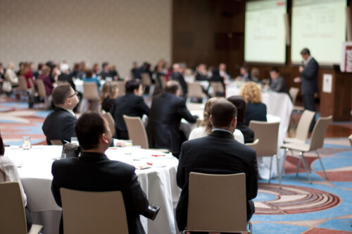 indoor conference room filled with attendees