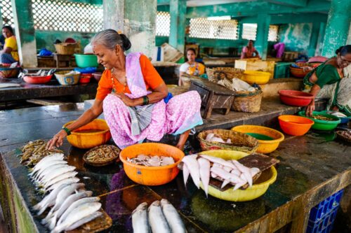 photo of woman organizing food in India