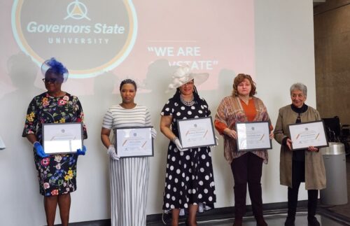 Sharva Hampton-Campbell is standing alongside the other women being honored by the Governers State University