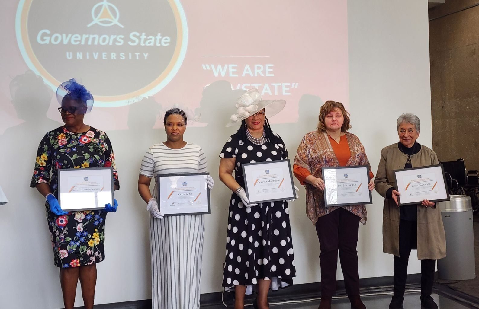 Sharva Hampton-Campbell is standing alongside the other women being honored by the Governers State University