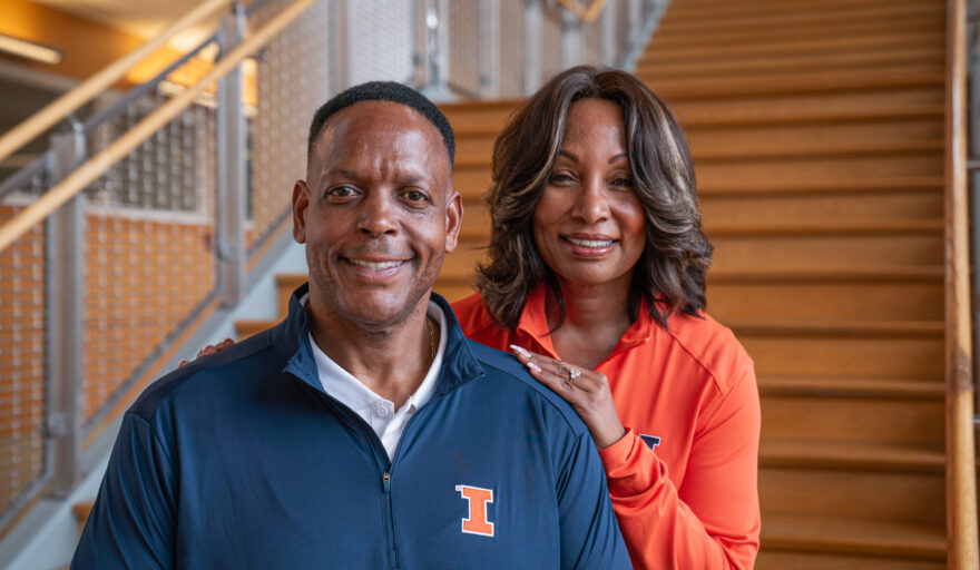 Deryk and Camille Gilmore on stairs at GIES College of Business