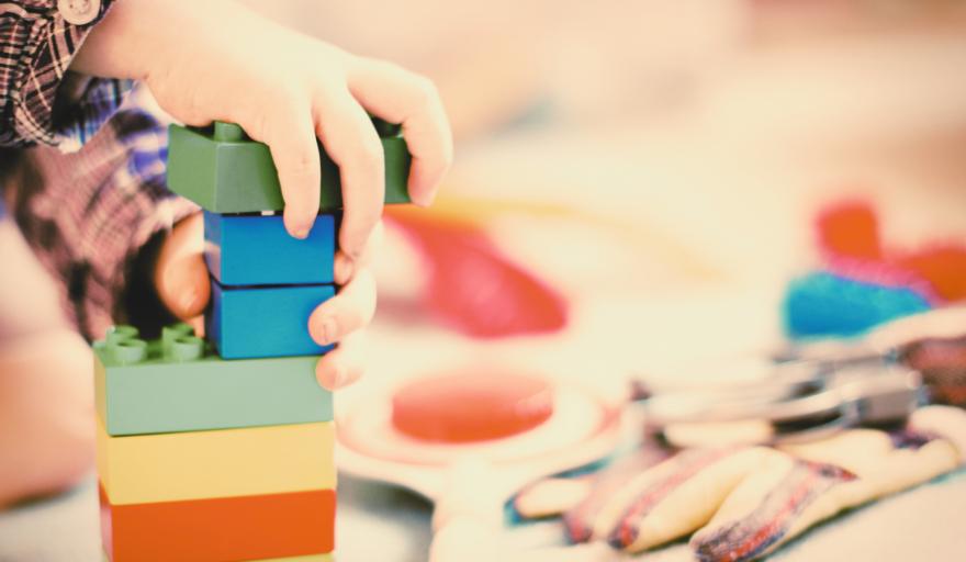 Children's hands playing with blocks